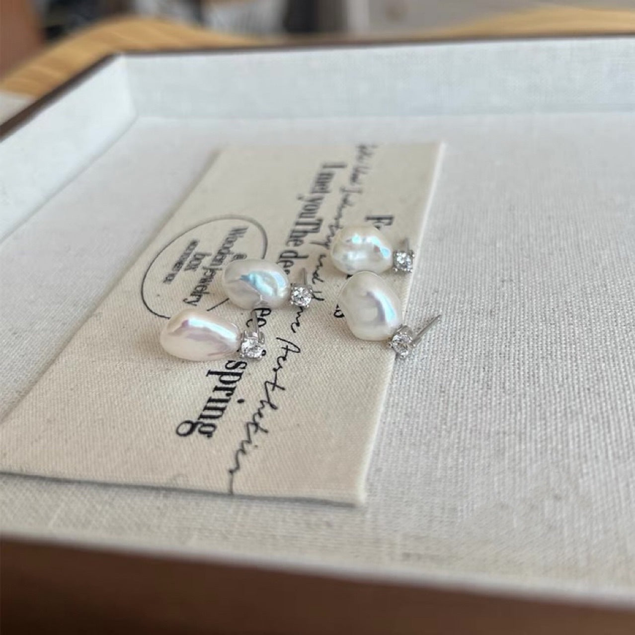 Baroque Pearl earrings with silver accents and diamond