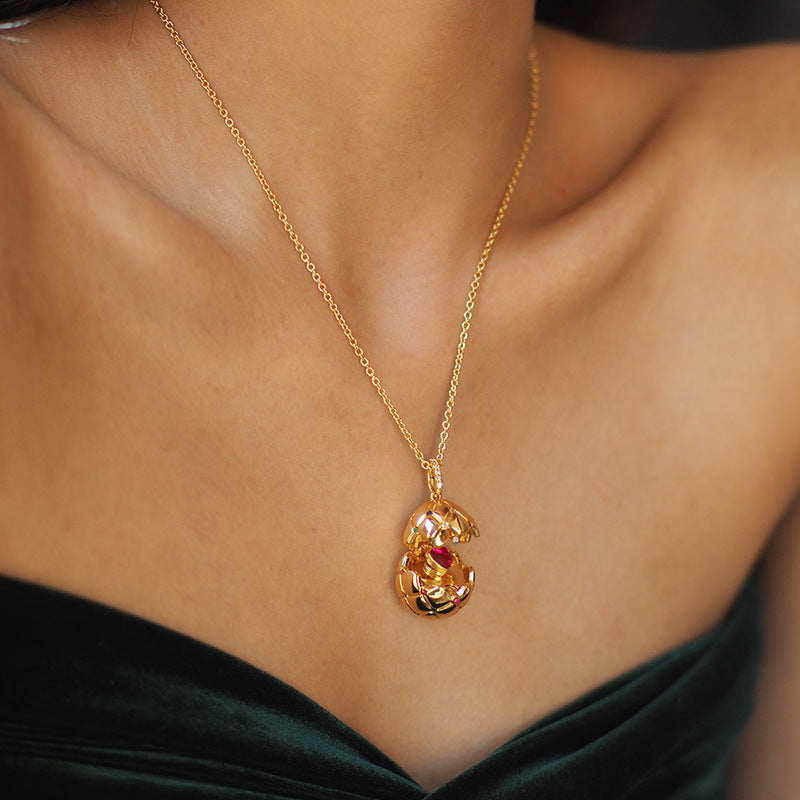 Vintage Lattice Egg Pendant Necklace with Heart Gem – Gold-Plated, Openable Design