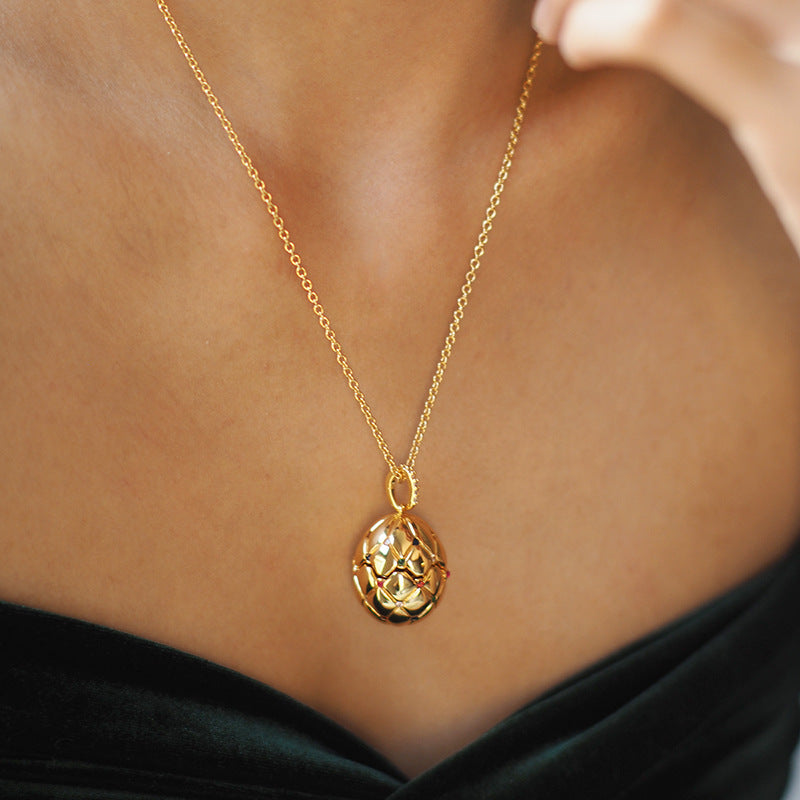 Vintage Lattice Egg Pendant Necklace with Heart Gem – Gold-Plated, Openable Design
