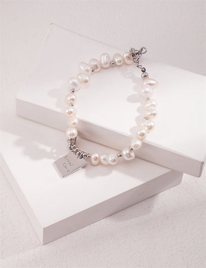 S925 Silber Reisperlenarmband mit Glücksbringer &amp; Herz