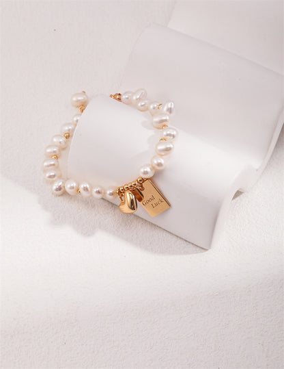S925 Silber Reisperlenarmband mit Glücksbringer &amp; Herz