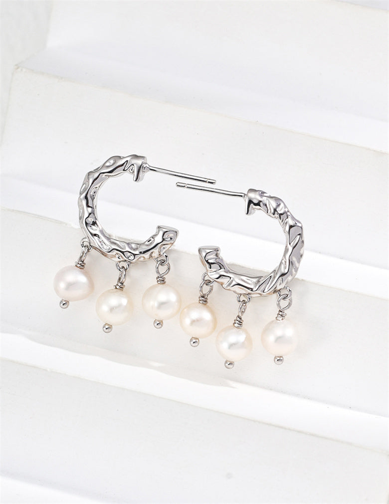 Boucles d'oreilles pendantes élégantes en perles naturelles