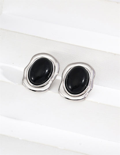 Minimalistische ovale Ohrstecker aus schwarzem Onyx/Perlmutt