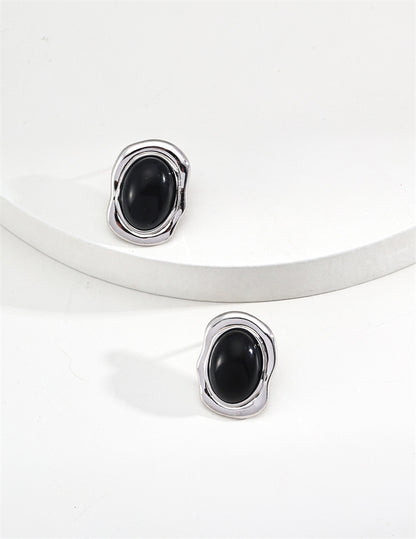Minimalistische ovale Ohrstecker aus schwarzem Onyx/Perlmutt