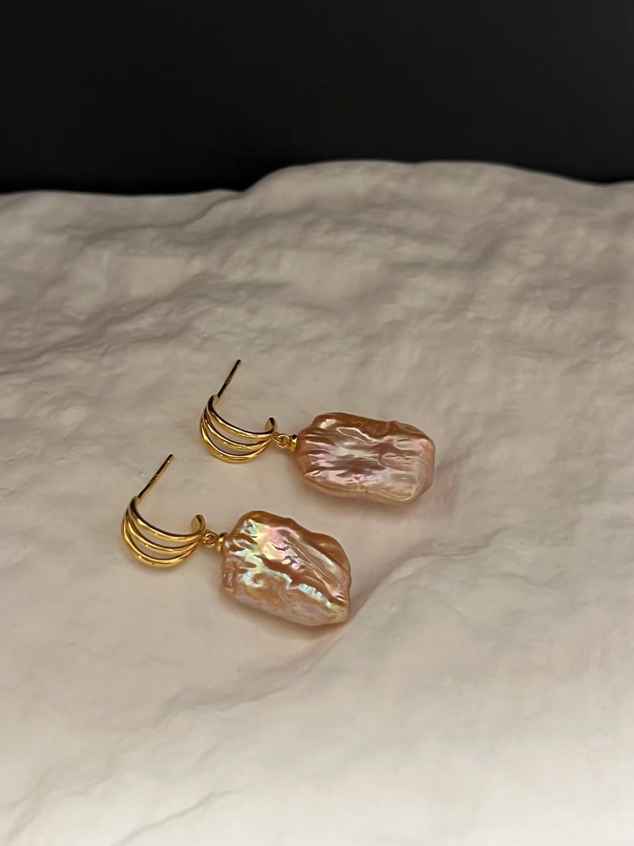 Gold earrings with peach pearls for bride