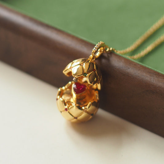 Vintage Lattice Egg Pendant Necklace with Heart Gem – Gold-Plated, Openable Design